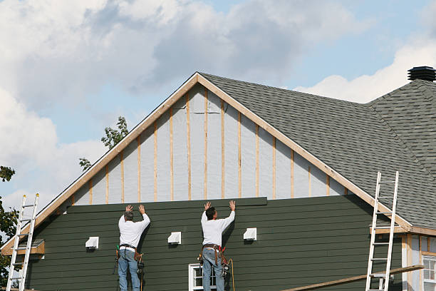 Professional Siding technician working in Wenham, MA
